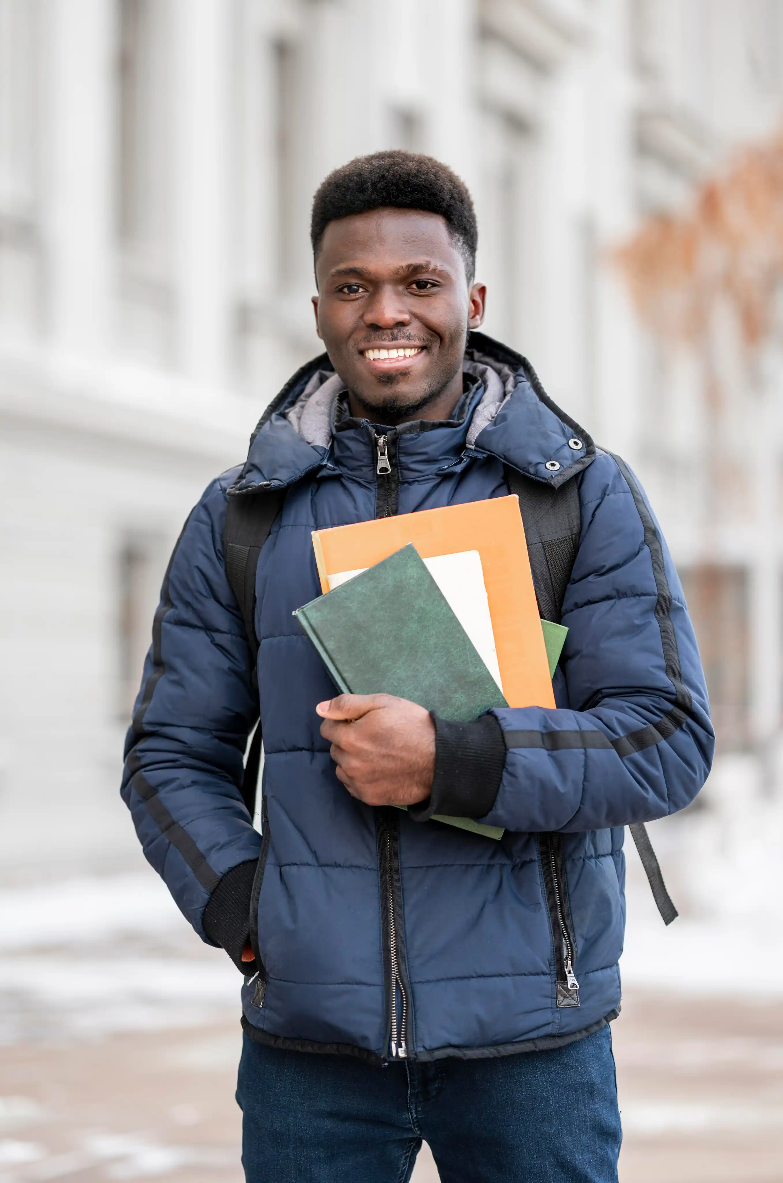 portrait-male-student-with-books
